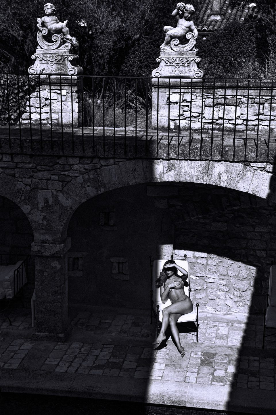 Stone Steps — Monochrome architecture, one figure, hard afternoon light.